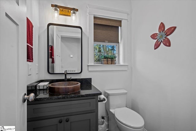 bathroom with vanity and toilet