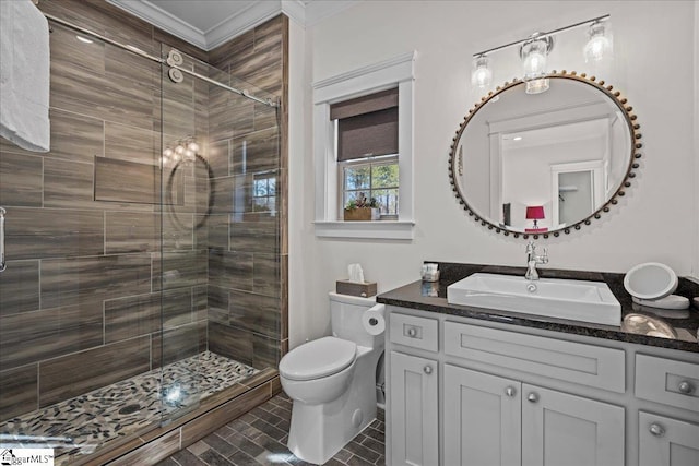 full bath featuring toilet, a shower stall, ornamental molding, and vanity