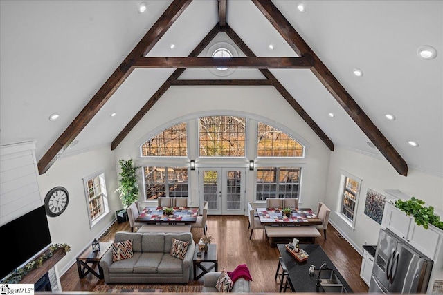 living area with high vaulted ceiling, recessed lighting, wood finished floors, french doors, and beam ceiling