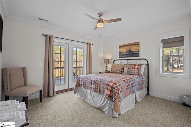 bedroom featuring access to exterior, multiple windows, and ornamental molding