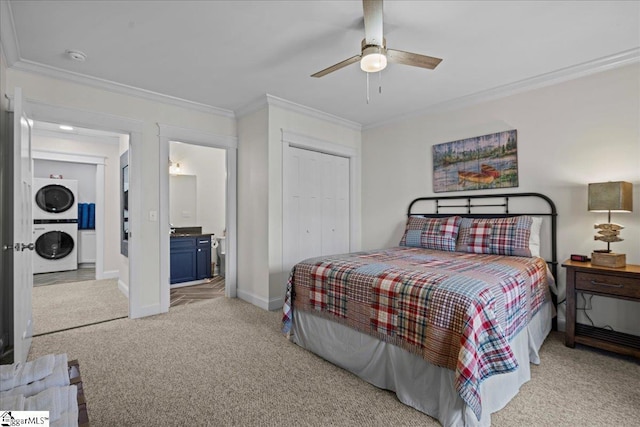 bedroom featuring stacked washer and dryer, baseboards, light colored carpet, ornamental molding, and a closet