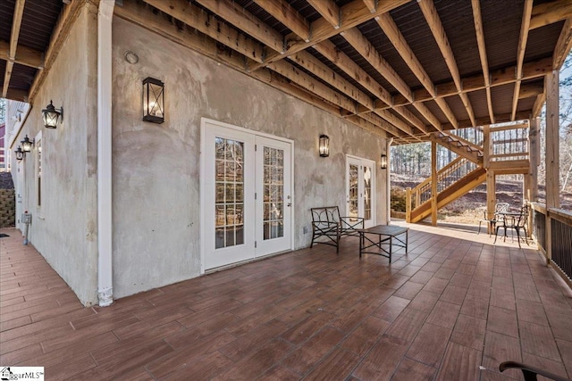 view of patio with french doors and stairway