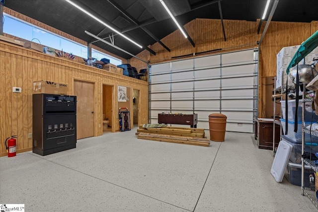 garage featuring wooden walls