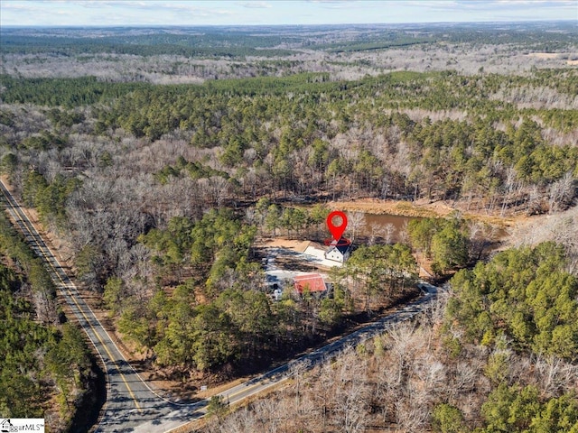 aerial view featuring a view of trees