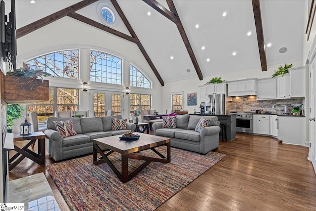 living room featuring high vaulted ceiling, dark wood finished floors, and beam ceiling