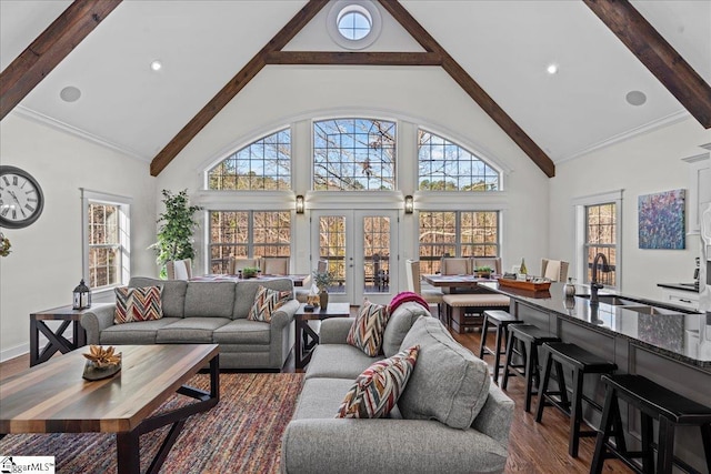 living room featuring dark wood finished floors, beamed ceiling, crown molding, french doors, and high vaulted ceiling