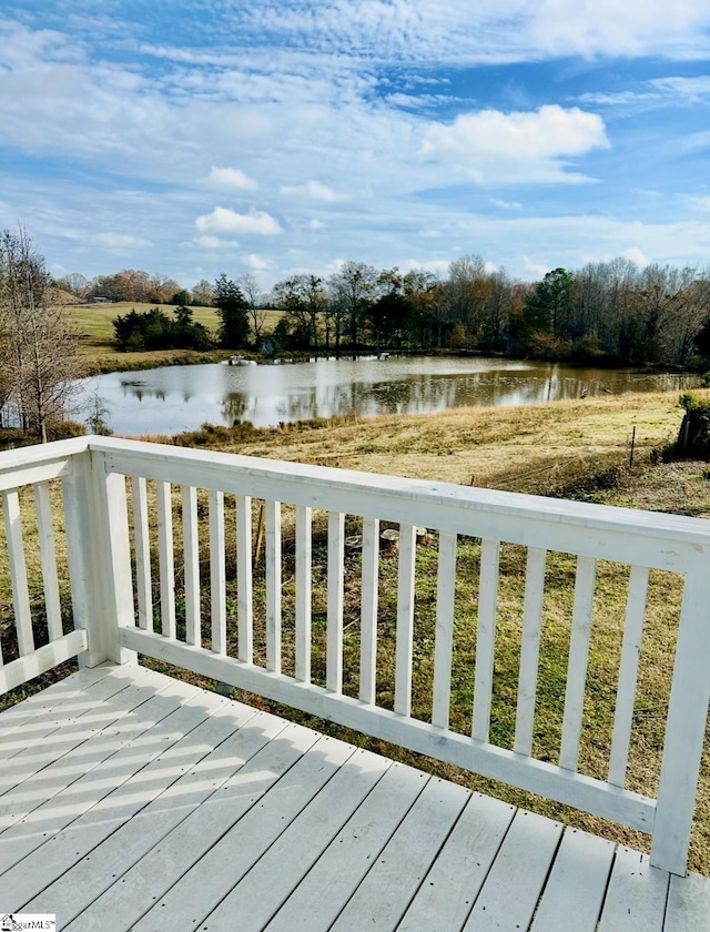 wooden deck featuring a water view