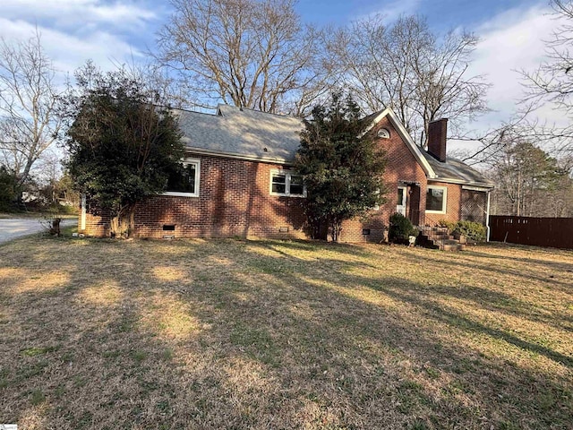 ranch-style house featuring brick siding, crawl space, a chimney, and fence