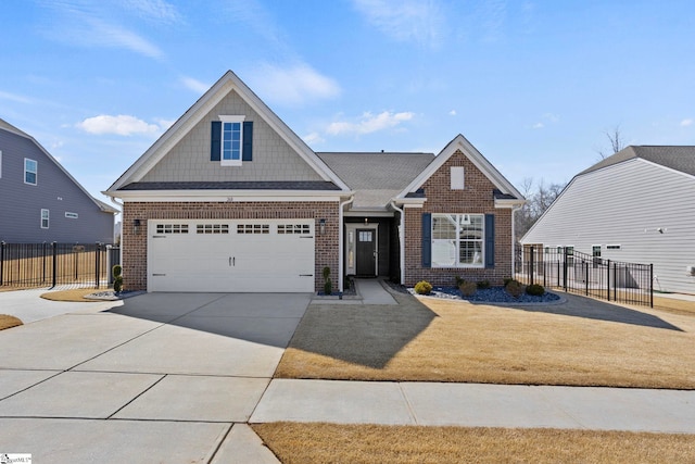 view of front of house with brick siding, driveway, and fence