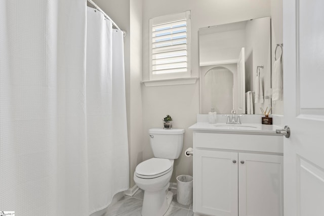 full bathroom featuring toilet and vanity