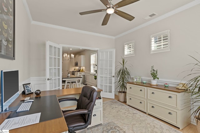 home office featuring ornamental molding, french doors, visible vents, and ceiling fan with notable chandelier