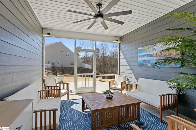 sunroom / solarium with a ceiling fan