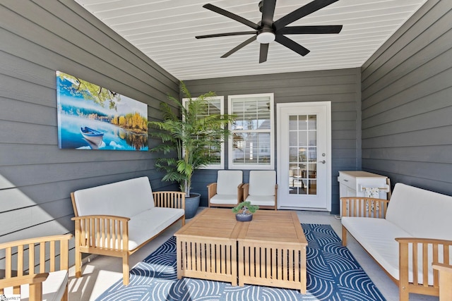 sunroom featuring a ceiling fan