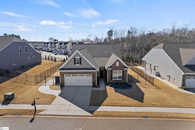 view of front of property with driveway, brick siding, a front yard, and fence