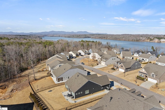 bird's eye view featuring a residential view and a water and mountain view