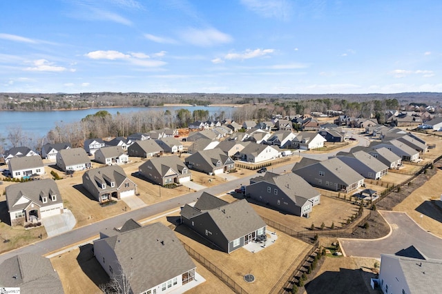 bird's eye view with a residential view and a water view