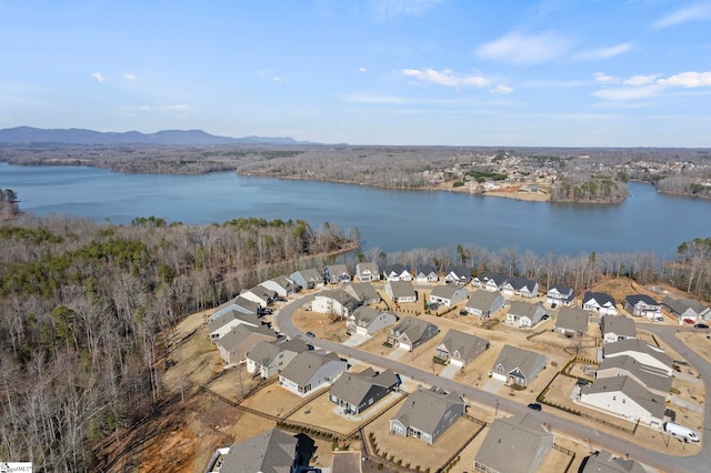 birds eye view of property featuring a water view and a residential view