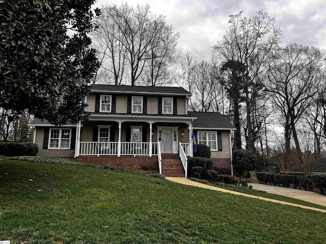 view of front of home with a front lawn and a porch