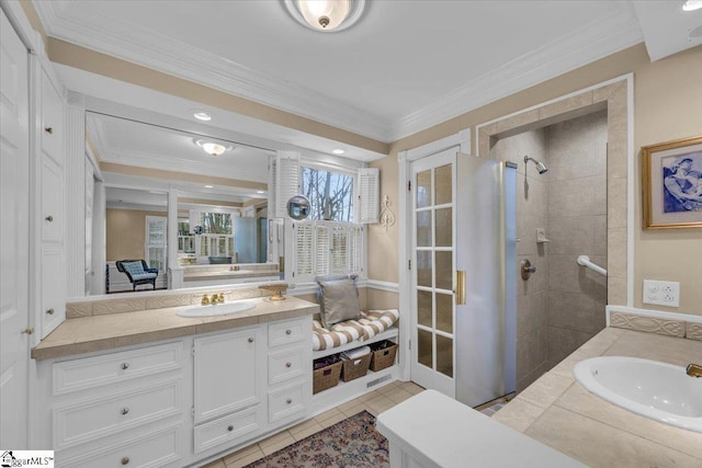 full bathroom with ensuite bathroom, vanity, ornamental molding, a tile shower, and tile patterned floors