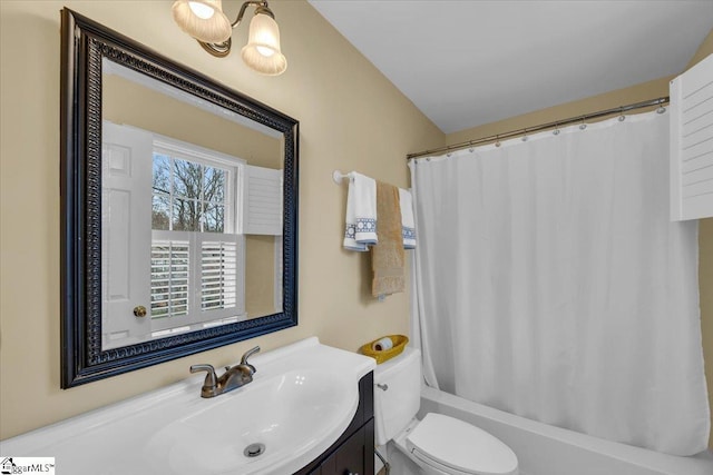 full bathroom featuring toilet, shower / bath combination with curtain, and vanity