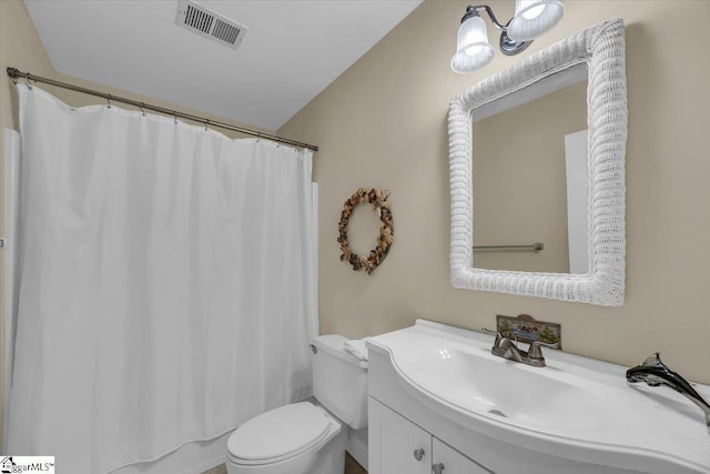 full bathroom with visible vents, vanity, and toilet