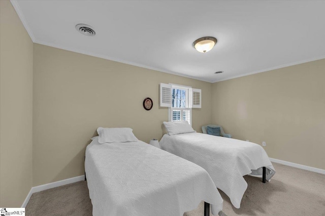 bedroom with carpet, visible vents, and baseboards