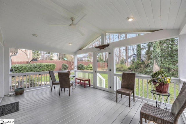 sunroom / solarium featuring lofted ceiling with beams, ceiling fan, wood ceiling, and a wealth of natural light