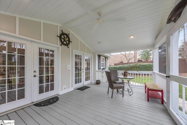 deck featuring a ceiling fan and french doors