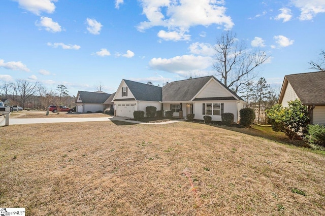 view of front facade featuring an attached garage and a front yard