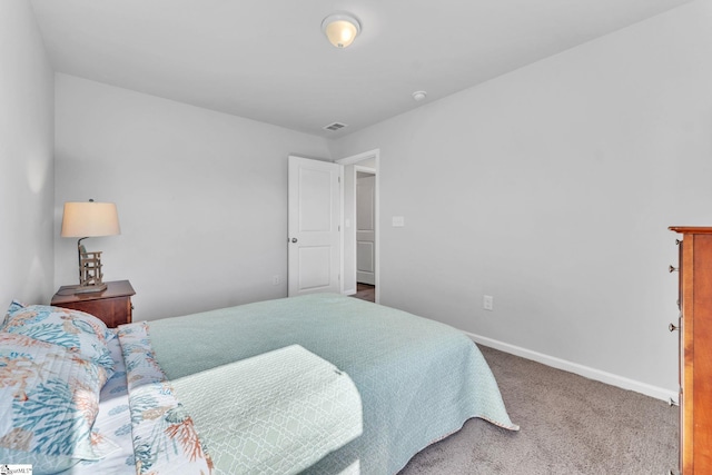 bedroom with carpet flooring, visible vents, and baseboards