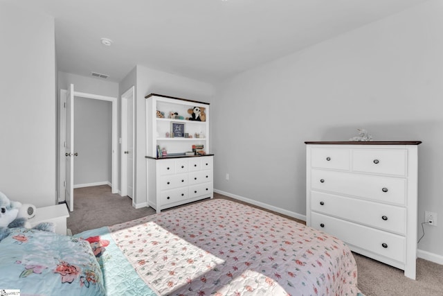 bedroom featuring visible vents, light carpet, and baseboards