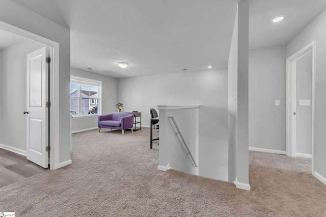 corridor with recessed lighting, carpet flooring, an upstairs landing, and baseboards