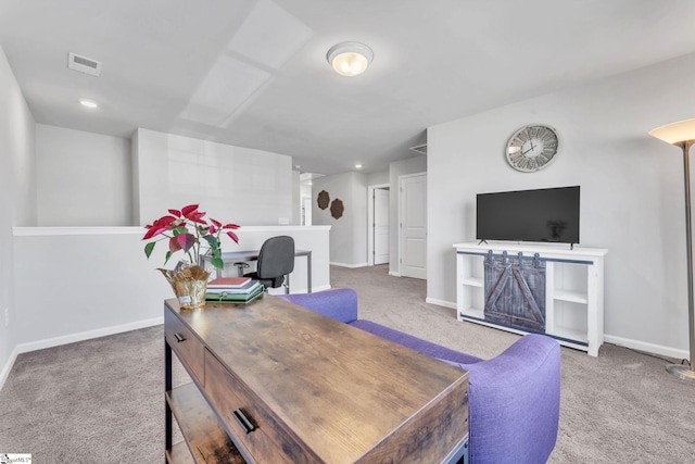 office area featuring baseboards, visible vents, and carpet flooring