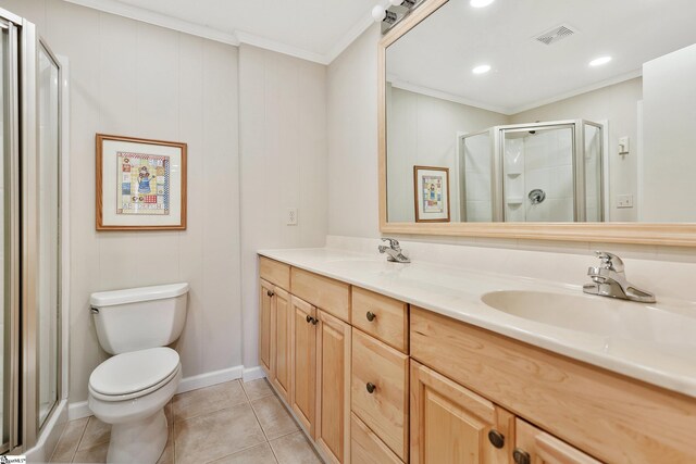 bathroom with a stall shower, visible vents, toilet, tile patterned flooring, and a sink