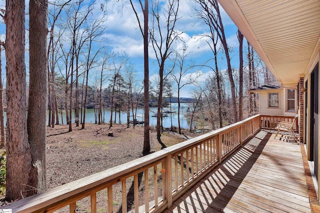 wooden deck featuring a water view