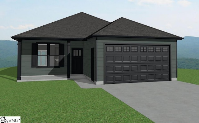 view of front of house featuring a garage, a front yard, concrete driveway, and a shingled roof