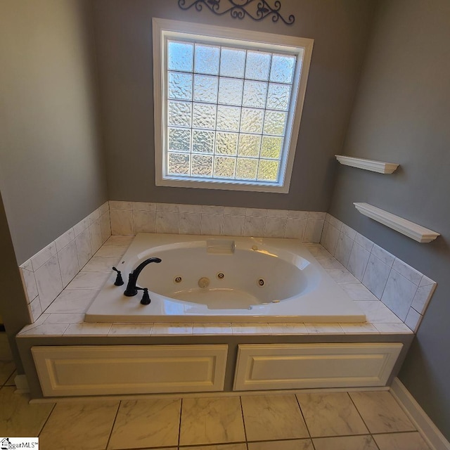 bathroom featuring a tub with jets