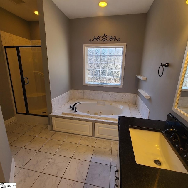 full bathroom with a stall shower, visible vents, a jetted tub, and vanity