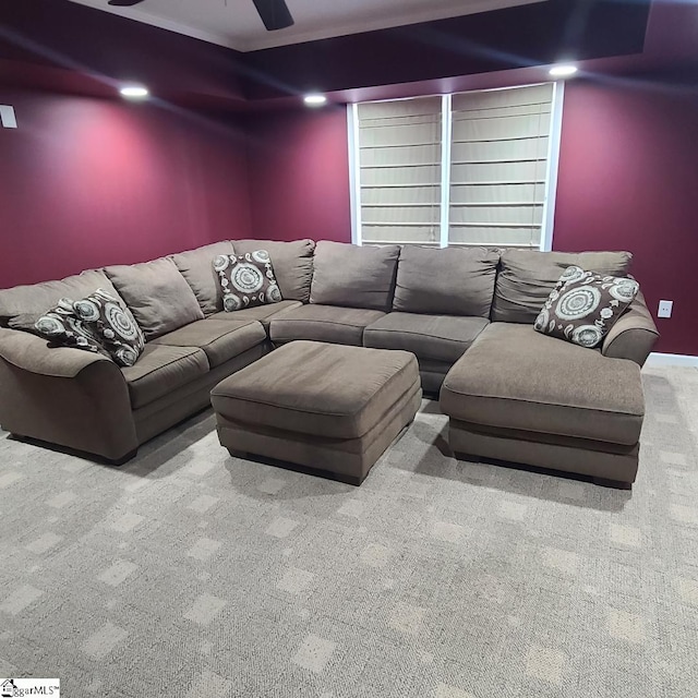 cinema with ceiling fan and carpet flooring