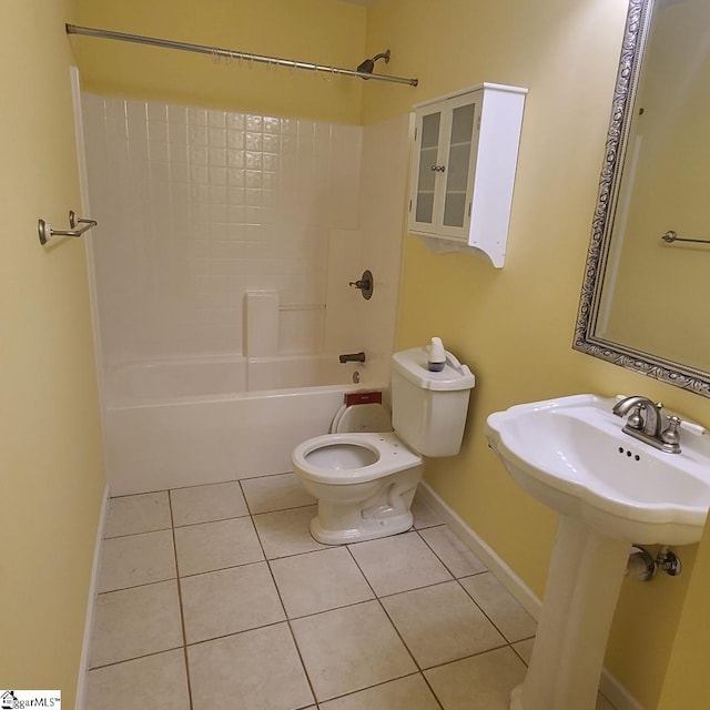 full bathroom featuring shower / tub combination, tile patterned flooring, toilet, a sink, and baseboards