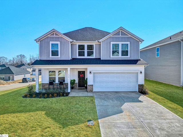 view of front of home featuring a garage, a porch, board and batten siding, and a front yard