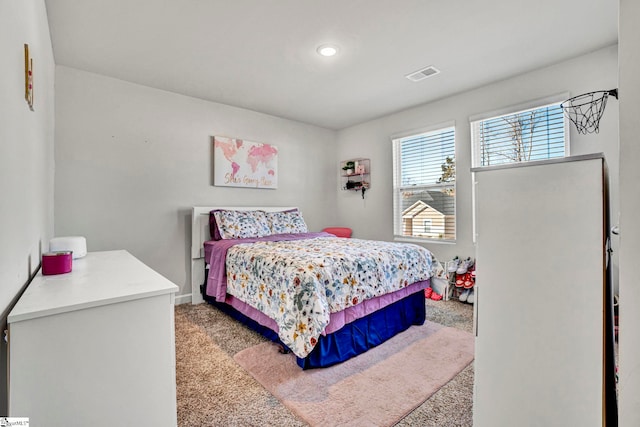 bedroom with carpet floors and visible vents