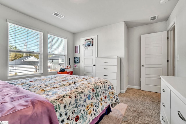 bedroom featuring light colored carpet, visible vents, and baseboards