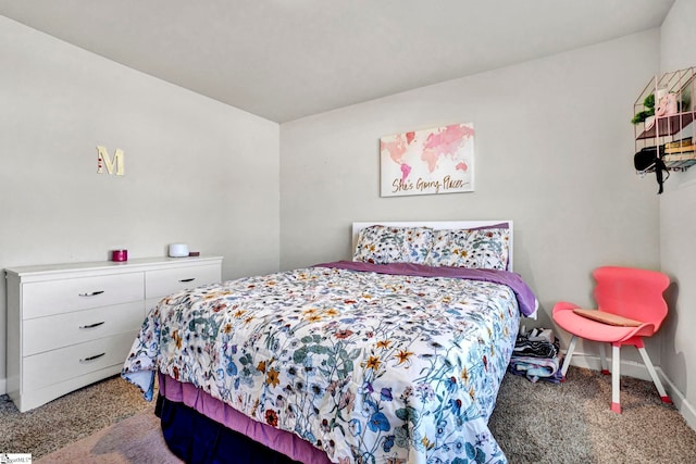 carpeted bedroom with baseboards