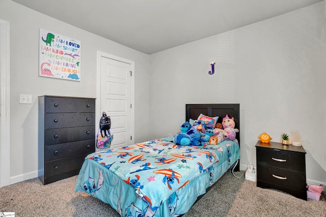 carpeted bedroom with baseboards