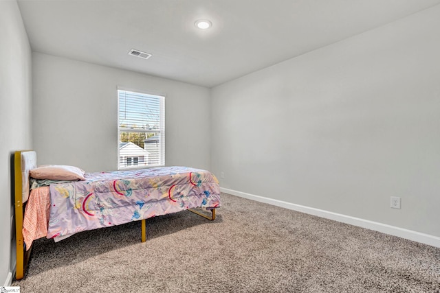 bedroom featuring carpet, visible vents, and baseboards