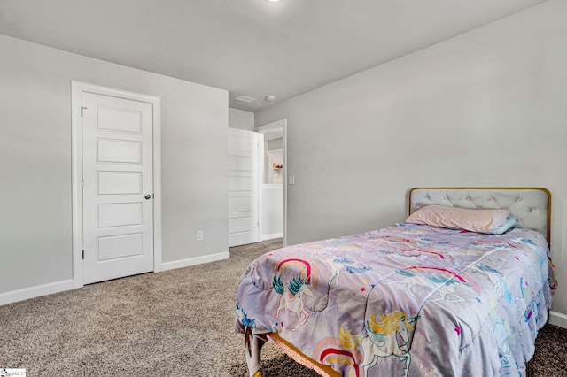 bedroom featuring carpet flooring and baseboards