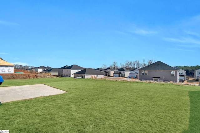 view of yard featuring a residential view