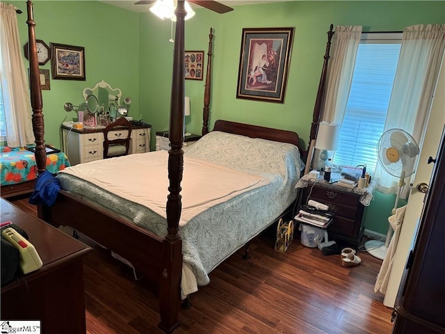 bedroom featuring a ceiling fan and wood finished floors