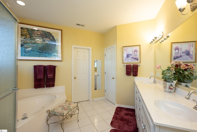 bathroom featuring double vanity, visible vents, a sink, and tile patterned floors